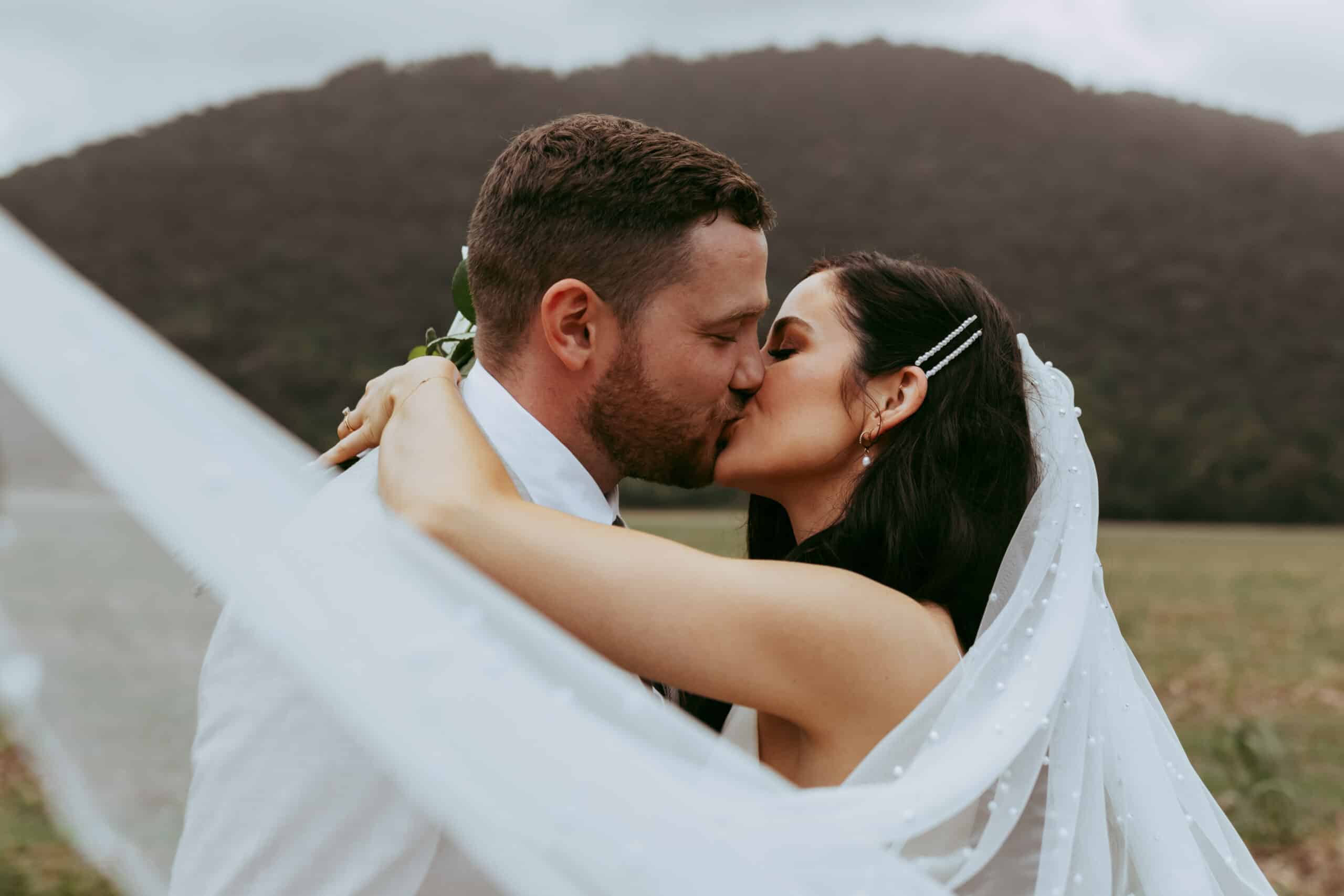 Mitch and Jade kissing on a wedding photoshoot near Cairns