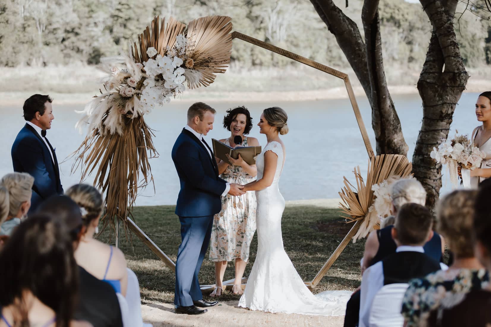 Cairns marriage celebrant Ali performing ceremony beside the water's edge